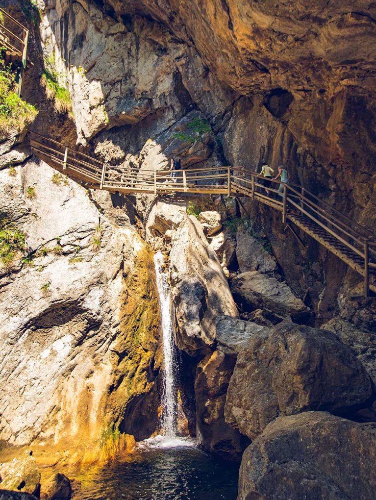 view-at-waterfall-path-along-mountain-stream-touri-potrait-1